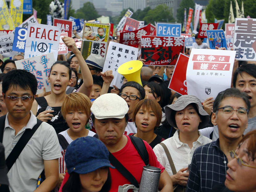 Protesters shout slogans during a rally in front of the National Diet building in Tokyo, Sunday, Aug 30, 2015. Photo: AP