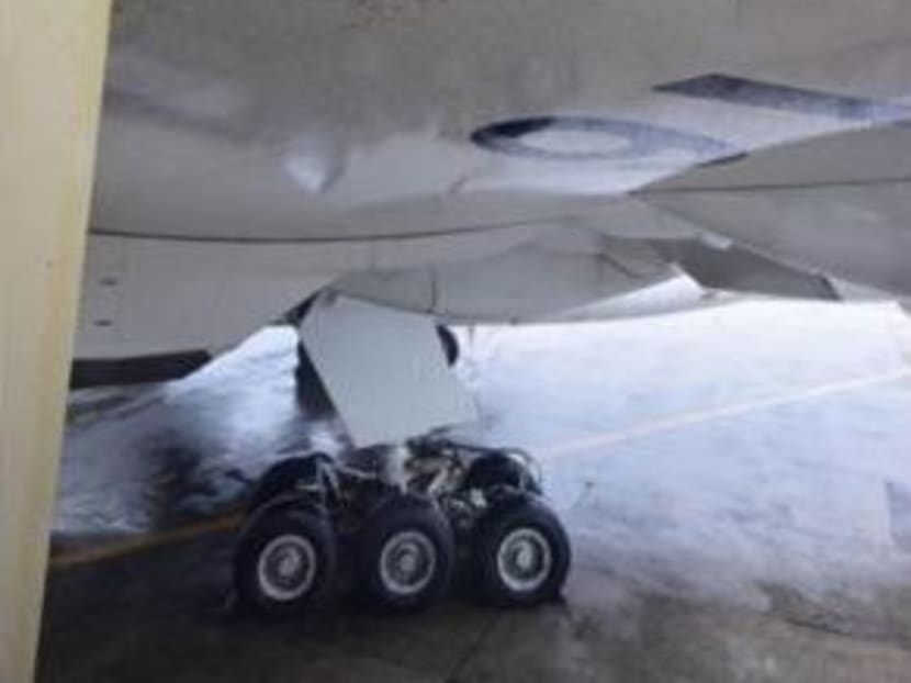 Gallery: Typhoon Rammasun causes SIA plane to hit aerobridge