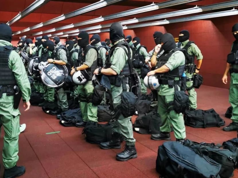 Officers from the Correctional Services Department suit up for their special constables duty. Officers from the Correctional Services Department suit up for their special constables duty.