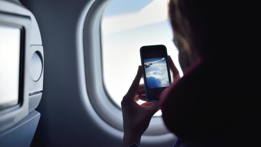 CNA Explains: Should you switch off your phone while on a flight?