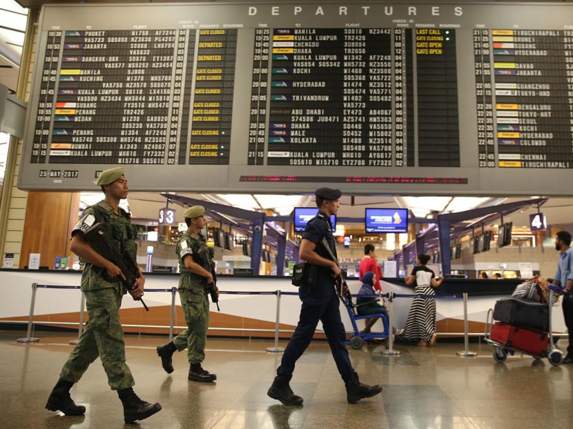 Security personnel are seen on patrol in Changi Airport, May 25, 2017. Photo: Wee Teck Hian/TODAY