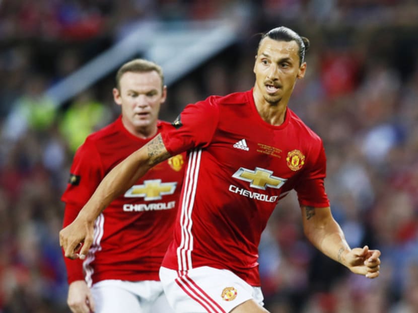 Mourinho says neither Wayne Rooney (background) nor Zlatan Ibrahimovic (front), his first-choice strikeforce, is suited to playing on the counter-attack. PHOTO: REUTERS