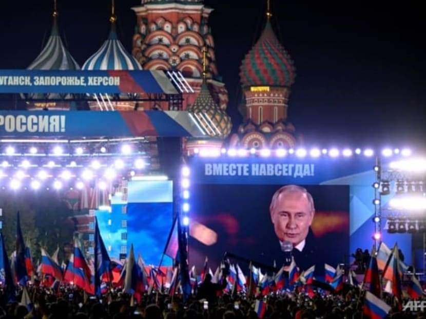 Russian President Vladimir Putin is seen on a screen at Red Square as he addresses a rally and a concert marking the annexation of four regions of Ukraine Russian troops occupy — Lugansk, Donetsk, Kherson and Zaporizhzhia, in central Moscow.