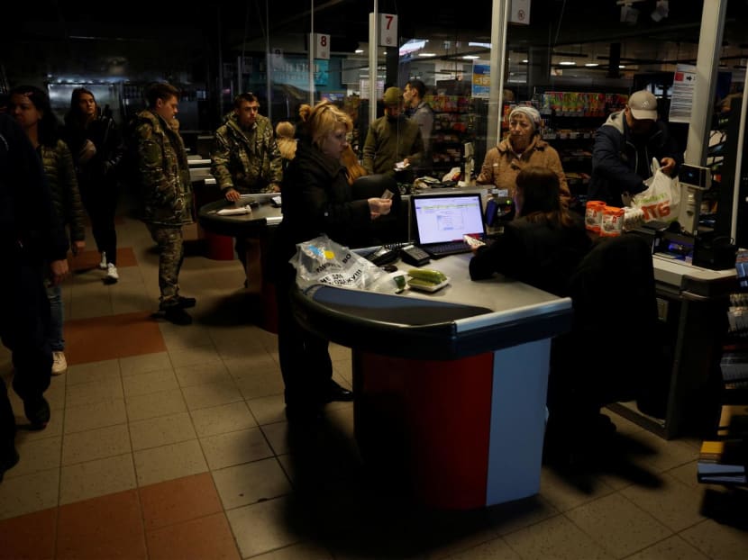 People shop in a supermarket as Kharkiv suffers an electricity outage, amid Russia's attack on Ukraine, in Kharkiv, Ukraine, Oct 17, 2022. People shop in a supermarket as Kharkiv suffers an electricity outage, amid Russia's attack on Ukraine, in Kharkiv, Ukraine, Oct 17, 2022.