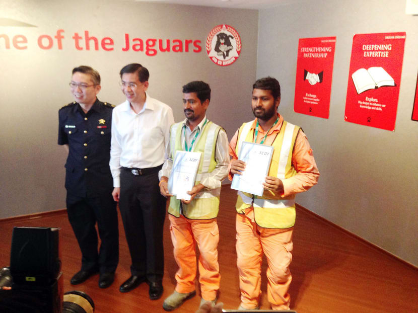 From left: Lt Col Michael Chua, MP for Jurong Ang Wei Neng, Mr S Shanmugamnathan and Mr P Muthukumar. 
Photo: Yvonne Lim