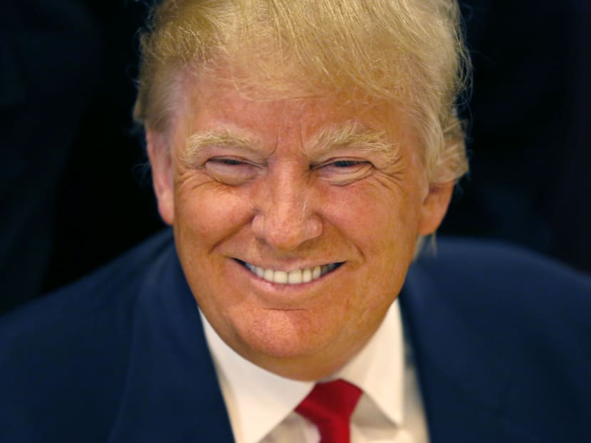 In this June 29, 2015, file photo, Republican presidential candidate Donald Trump smiles for a photographer before he addresses members of the City Club of Chicago, in Chicago. Photo: AP