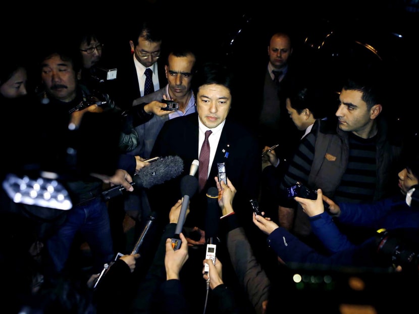 Japanese Deputy Foreign Minister Yasuhide Nakayama (centre) speaking to the press in Amman, Jordan, where he was sent to coordinate Japan’s hostage rescue efforts. Photo: AP