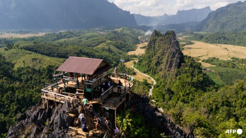 Laos hostel staff detained after backpackers' deaths from suspected methanol poisoning