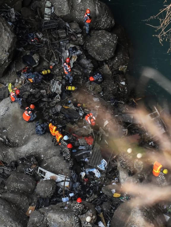 Rescue teams search for victims at the site of the Yeti Airlines plane crash, in Pokhara on Jan 17, 2023. Rescue teams search for victims at the site of the Yeti Airlines plane crash, in Pokhara on Jan 17, 2023.