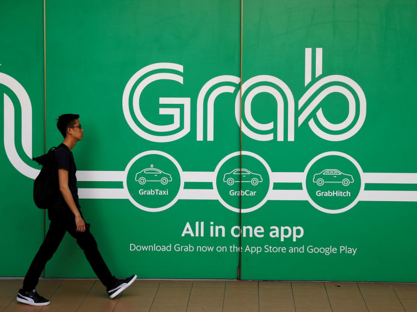 A man walking past a Grab office in Singapore in March 2018.