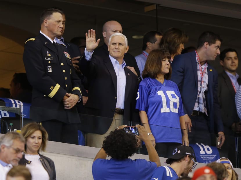 Vice President Mike Pence (seen here waving to fans) with his wife Karen on Sunday (Oct 8) during the Colts-49ers game in Indianapolis.