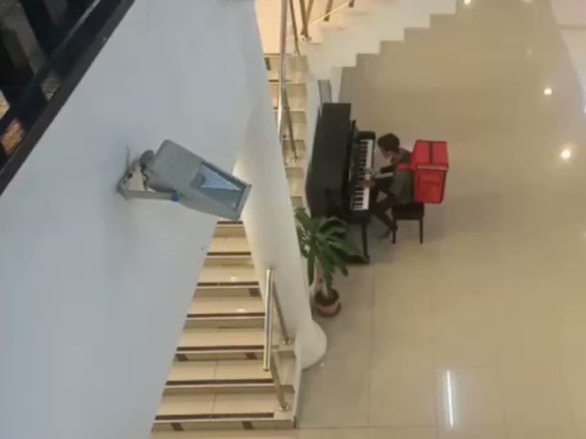 A food delivery rider waiting for his customer to collect an order on April 11 decided to kill time by playing a tune on a piano in the lobby of the International Youth Centre in Kuala Lumpur.