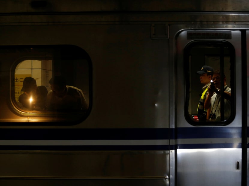 Policemen check a train after an explosion at the Songshan train station in Taipei, Taiwan July 7, 2016. Photo: Reuters
