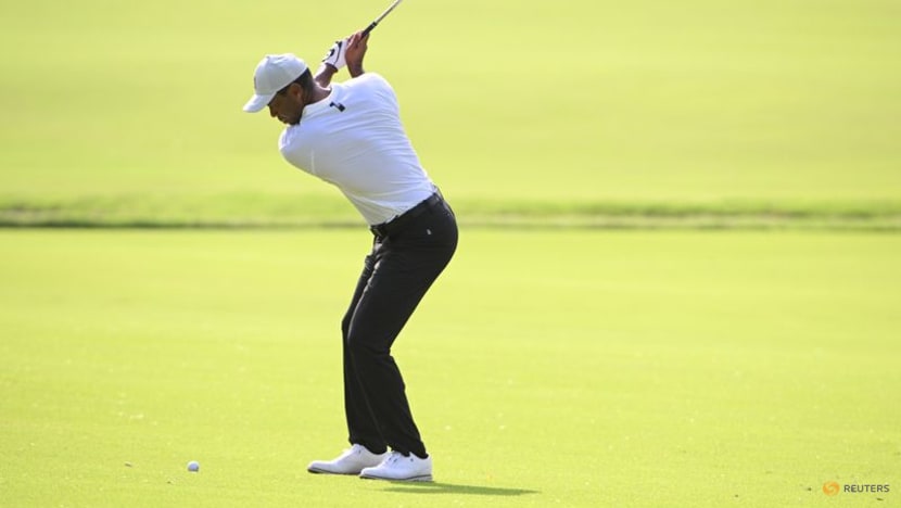 McIlroy grabs PGA Championship lead as Woods falters