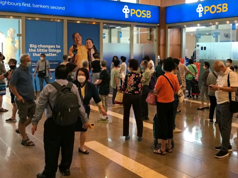 People queuing up to get new dollar notes outside bank branches at Toa Payoh Central on Jan 25, 2021.