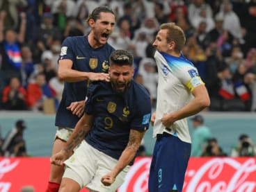 France's forward Olivier Giroud (centre) and France's defender Theo Hernandez (left) celebrating after England's forward Harry Kane (right) missed a second penalty kick during the Qatar 2022 World Cup quarter-final football match at the Al-Bayt Stadium in Al Khor, north of Doha, on Dec 10, 2022.