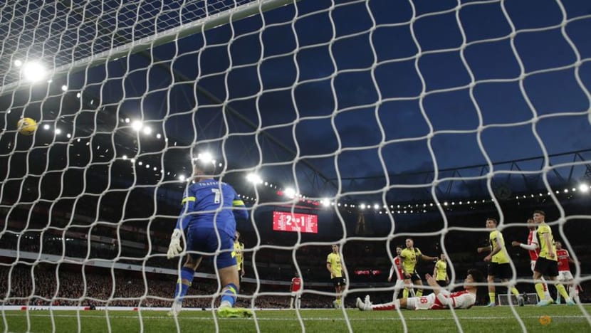 Arsenal win to move level with Man City Spurs slip up at Wolves CNA