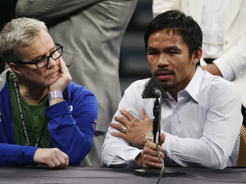 In this May 2, 2015 photo, trainer Freddie Roach, left, listens as Manny Pacquiao answers questions during a press conference following his welterweight title fight against Floyd Mayweather Jr in Las Vegas. Photo: AP