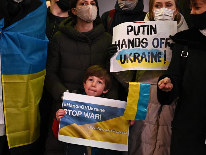 A child holds a slogan that reads “stop war” during a protest against Russia's actions in Ukraine during a rally at Shibuya district in Tokyo, Japan on Feb 24, 2022.