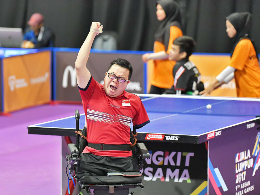 Jason Chee letting out a yell and raising his arm in triumph after winning the Class 2 men's singles gold medal at the Asean Para Games in Kuala Lumpur. Photo: Foo Tee Fok/Sport Singapore