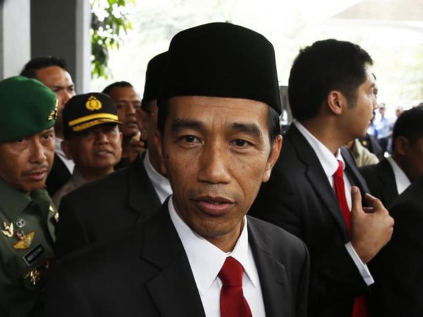 Indonesia's President-elect Joko Widodo looks on after a ceremony inaugurating a new parliament in Jakarta on October 1, 2014. Photo: Reuters