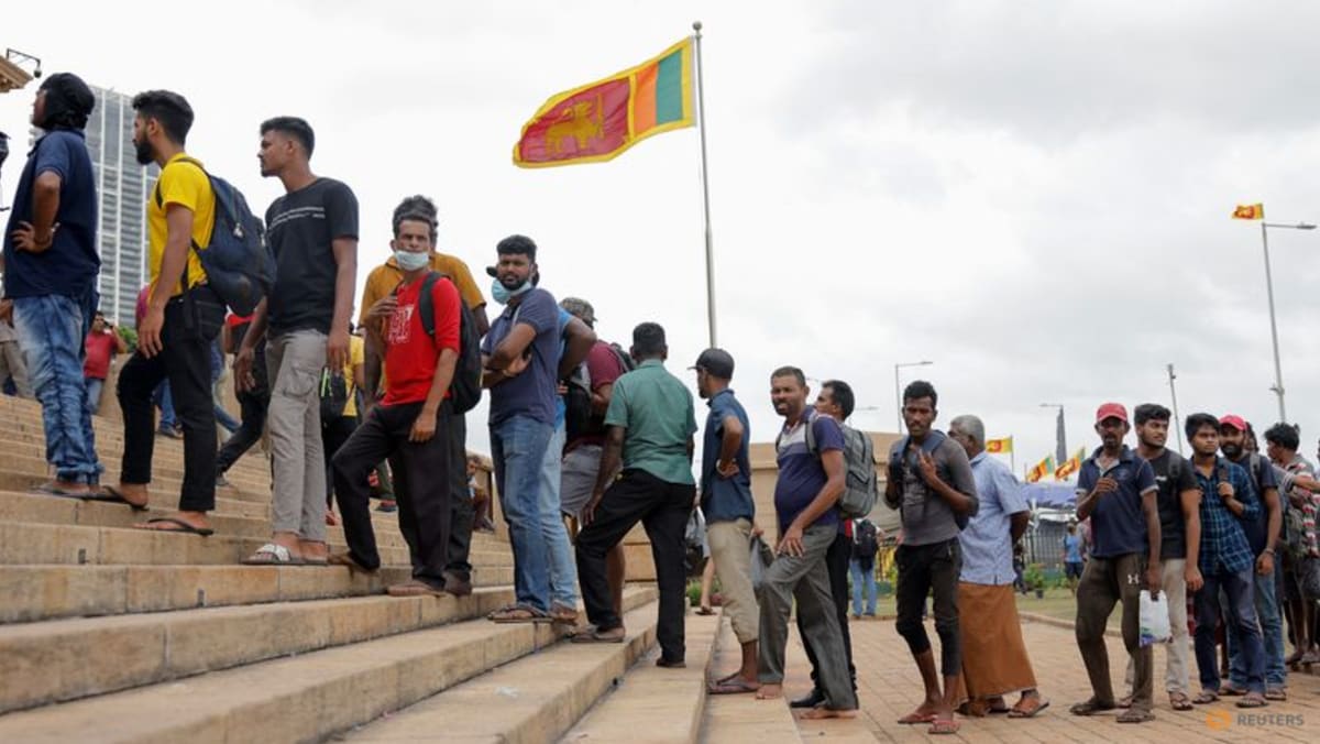 Sri Lankans throng ransacked presidential palace amid political chaos