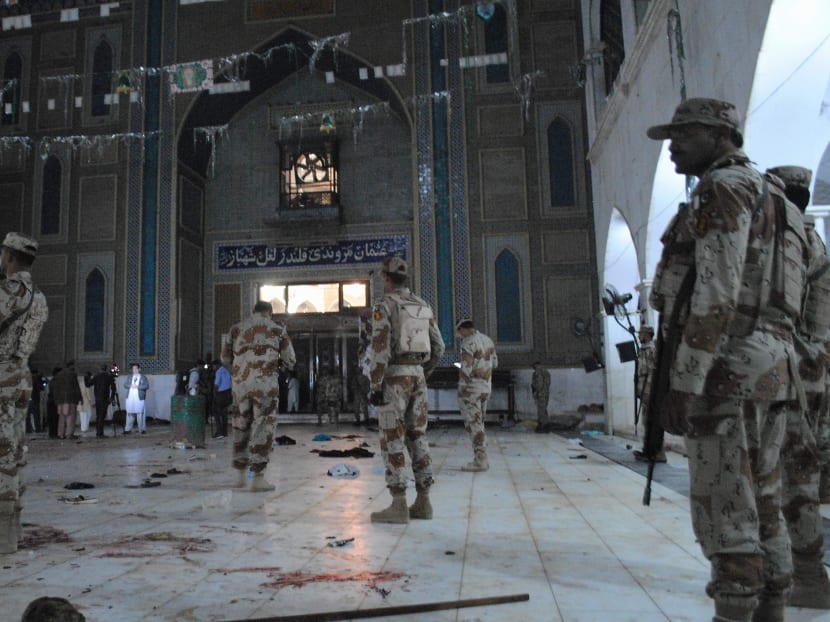 Pakistani para-military soldiers stand alert after a deadly suicide attack at the shrine of famous Sufi Lal Shahbaz Qalandar in Sehwan, Pakistan, Thursday, Feb 16, 2017. Photo: AP