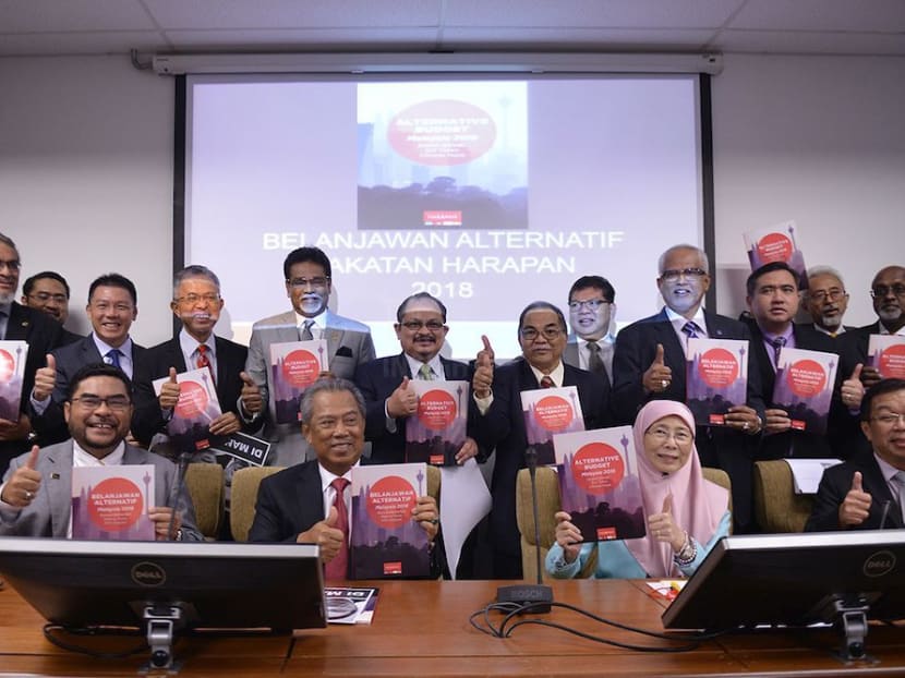 Pakatan Harapan leaders showing their Budget 2018 booklets.The Malaysian Insight file photo