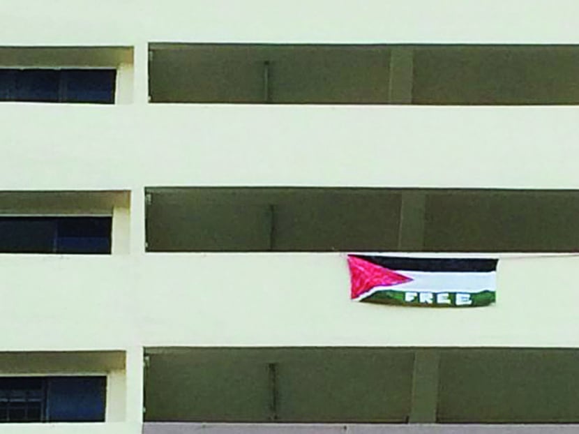 A Palestinian flag was seen hanging on the 11th floor of Block 54 Sims Drive yesterday. PHOTO: TODAY READER YUSOF