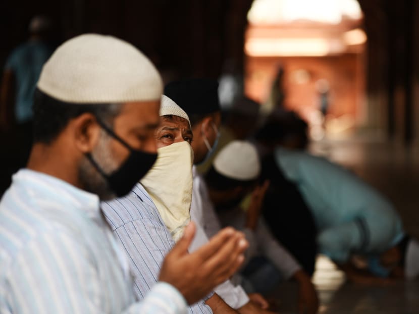 Muslim devotees offer prayers at the Jamma Masjid as places of religious worship, hotels, restaurants and shopping malls are allowed to operate again after more than two months of lockdown imposed as a preventive measure against Covid-19 in the old quarters of New Delhi on June 8, 2020.