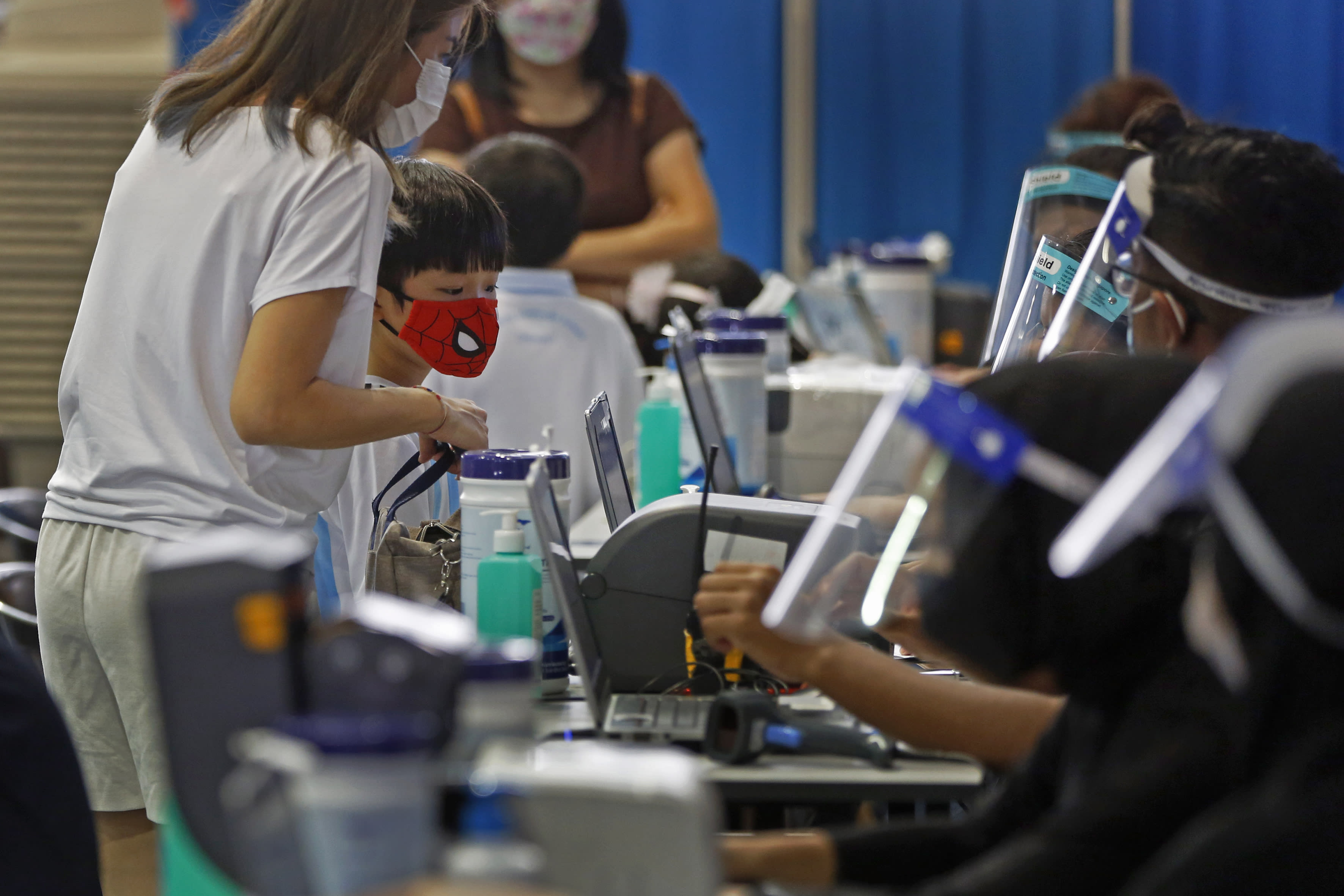 A parent and her child is seen at a paediatric vaccination centre for those aged five to 11 at Our Tampines Hub on Jan 12, 2022. A parent and her child is seen at a paediatric vaccination centre for those aged five to 11 at Our Tampines Hub on Jan 12, 2022.
