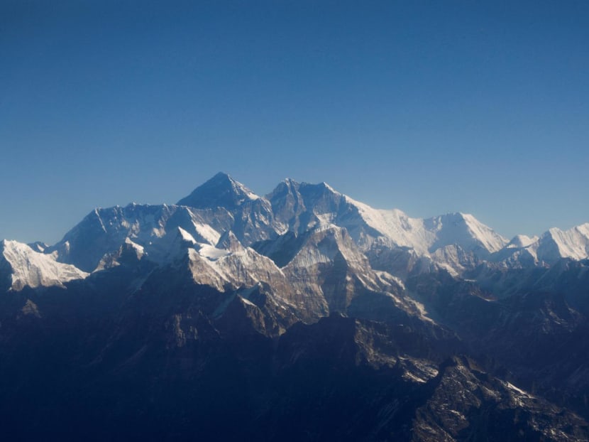 Mount Everest, the world highest peak, and other peaks of the Himalayan range are seen through an aircraft window during a mountain flight from Kathmandu, Nepal on Jan 15, 2020.