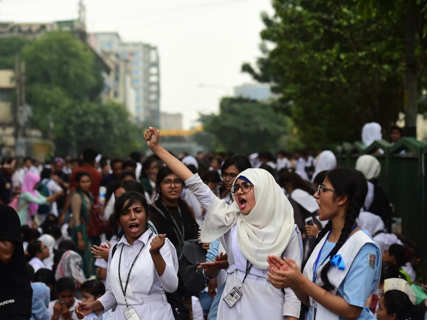 Bangladeshi students block a road during a student protest in Dhaka on August 4, 2018, following the deaths of two college students in a road accident.