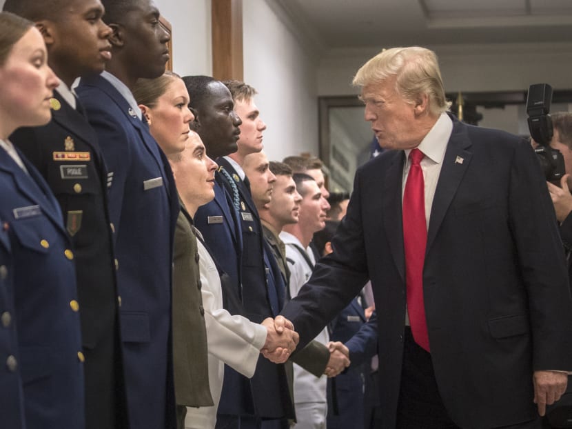 President Donald Trump greets military personnel at the Pentagon after a closed-door briefing in Arlington, Va., July 20, 2017. Photo: The New York Times