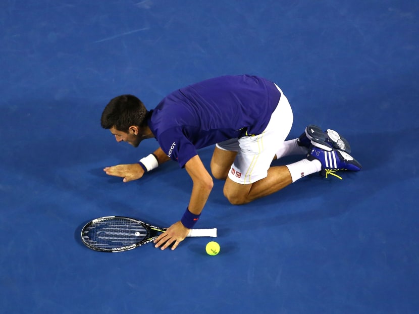 Novak Djokovic of Serbia kisses the ground at Rod Laver Arena after winning the Men's Singles Final over Andy Murray of Great Britain during day 14 of the 2016 Australian Open at Melbourne Park on January 31, 2016 in Melbourne, Australia. Photo: Getty Images