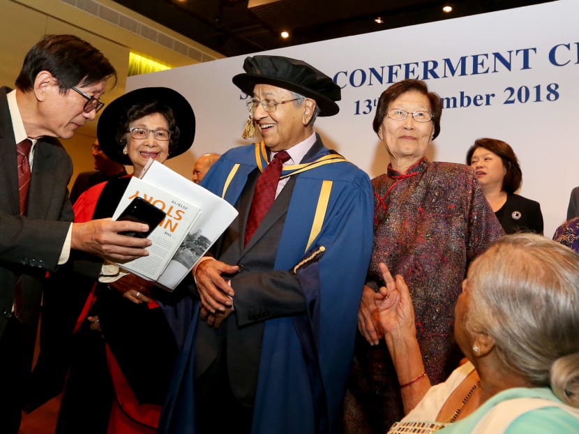 Malaysia’s Prime Minister Mahathir Mohamad (third from left) met his former classmates from the King Edward VII College of Medicine, the predecessor institution of the National University of Singapore. He was conferred the Honorary Doctor of Laws on Nov 13, 2018, during his visit to Singapore. His wife, Dr Siti Hasmah (second from left), was also presented with the Distinguished Alumni Service Award.