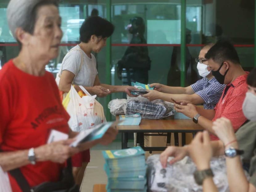 Members of the public queuing up to collect reuseable masks at Chong Pang community centre on April 5, 2020.