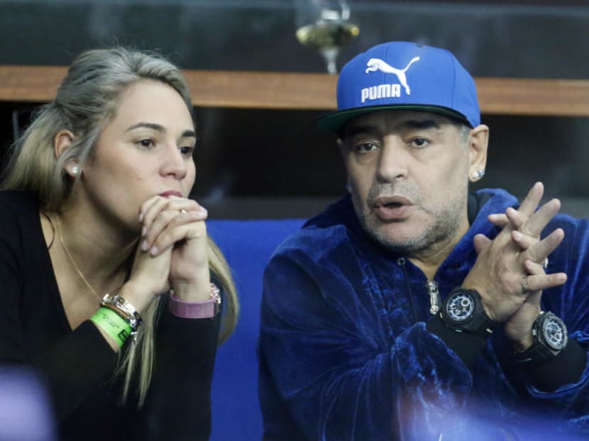 Diego Maradona sitting with his companion Rocio Oliva at a Davis Cup finals tennis match in Zagreb, Croatia, in November. Police say they were called to investigate an altercation involving Diego Maradona and a woman at a hotel in Madrid. on Wednesday (Feb. 15) after a call from the hotel, but found no evidence of any disturbance after talking to Maradona and the woman. Photo: AP