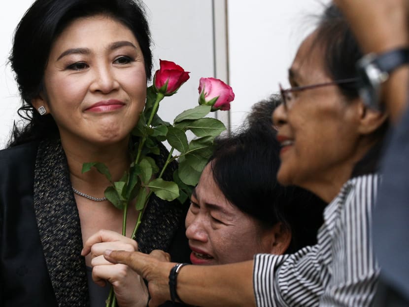 Reuters file photo of ousted former Thai prime minister Yingluck Shinawatra greeting supporters as she arrives at the Supreme Court in Bangkok, Thailand, August 1, 2017.