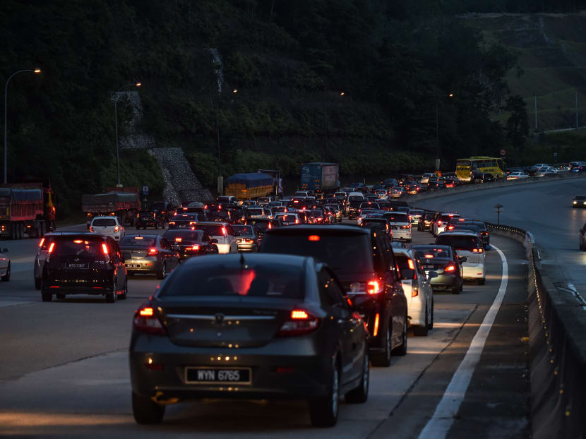 Motorists are caught in a traffic jam along a highway in Bentong, outside Kuala Lumpur. Malaysian police say on Monday (Nov 27) that a total of 61,057 traffic summonses issued in the country since 2014 have yet to be settled, with over half of them from errant Singaporean drivers. Photo: AFP