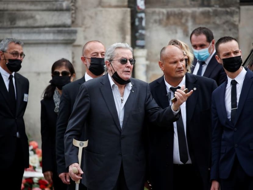 Family, stars including Alain Delon bid farewell to iconic French actor Belmondo
