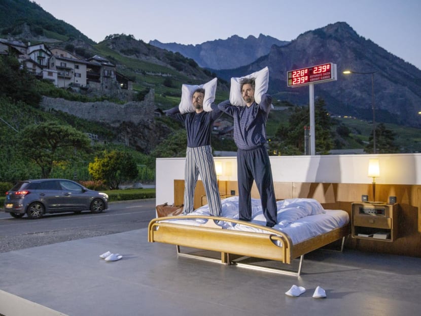 Swiss artists Frank and Patrik Riklin pose on the bed in the anti-idyllic suite of the Null-Stern-Hotel (Zero-Star-Hotel), offering guests a choice between four open-air rooms in reaction to the world current state after the pandemic, in Saillon, Switzerland June 14, 2022.