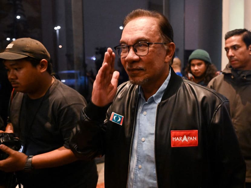 Pakatan Harapan chairman Anwar Ibrahim (centre) reacts at the end of a press conference in Kuala Lumpur on Nov 20, 2022.
