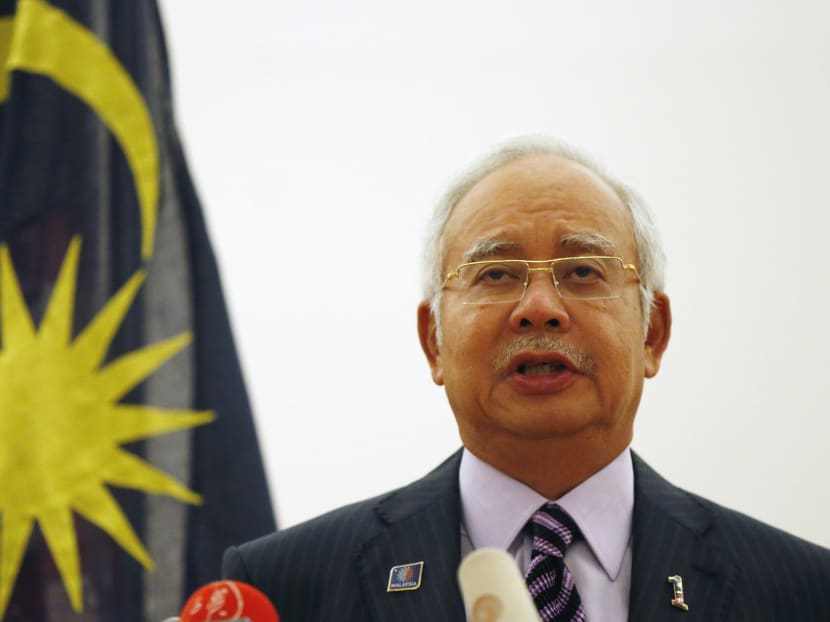 Mr Najib at the news conference in Kuala Lumpur early this morning. He said the black boxes from Flight MH17 will be handed over to Malaysia by Ukrainian rebels. REUTERS