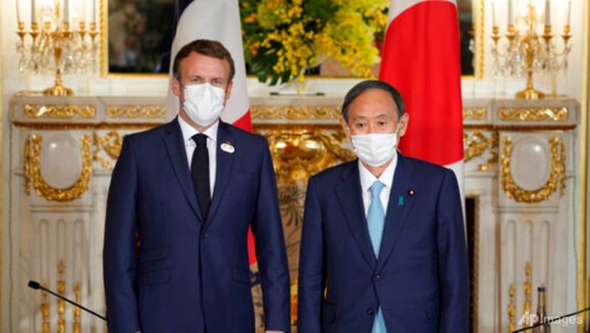 Macron meets Japan PM on Olympic visit Macron meets Japan PM on Olympic visit