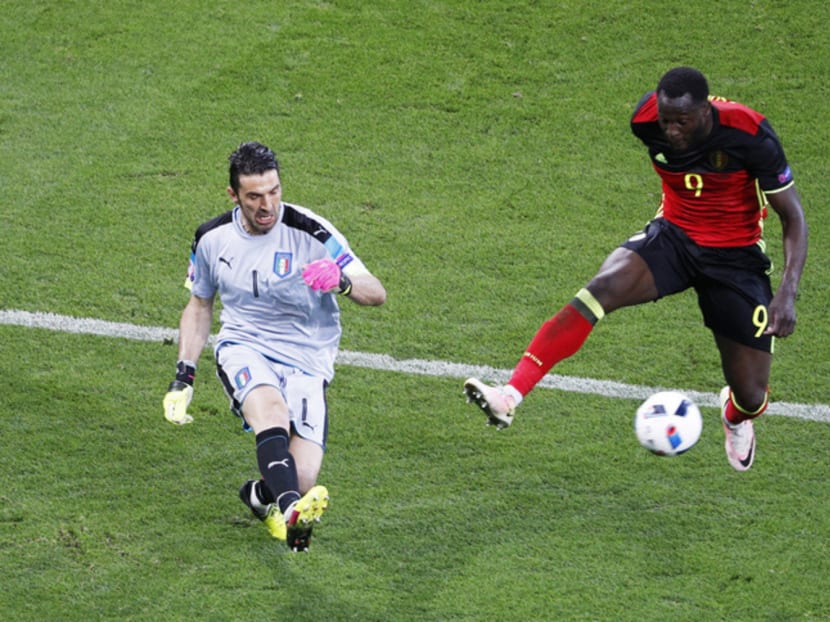 Belgium’s Romelu Lukaku (right) in action against  Italy’s Gianluigi Buffon. Photo: REUTERS