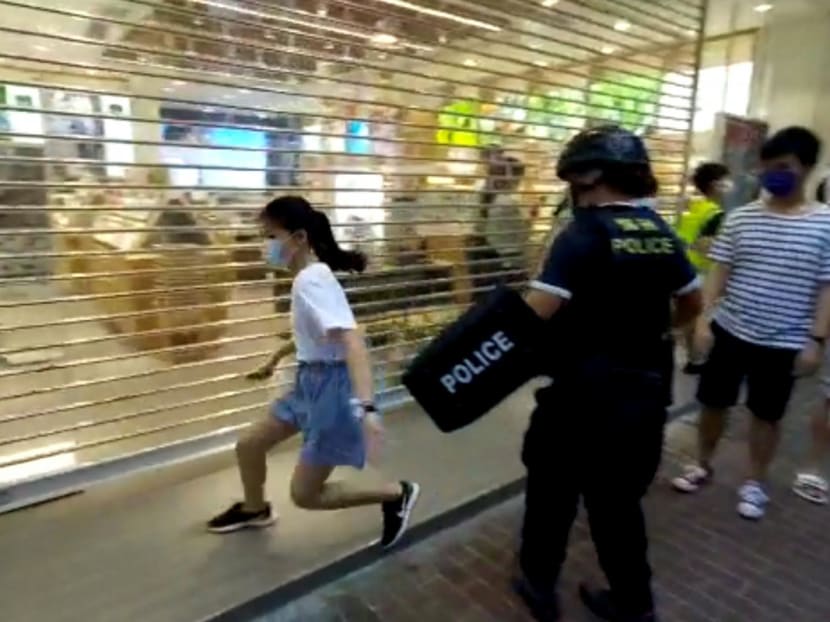The young girl runs away from police during the protest in Hong Kong on Sunday (Sept 6). The young girl runs away from police during the protest in Hong Kong on Sunday (Sept 6).