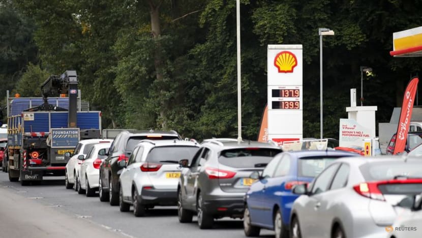 Behave normally, UK transport minister tells Britons queuing for fuel