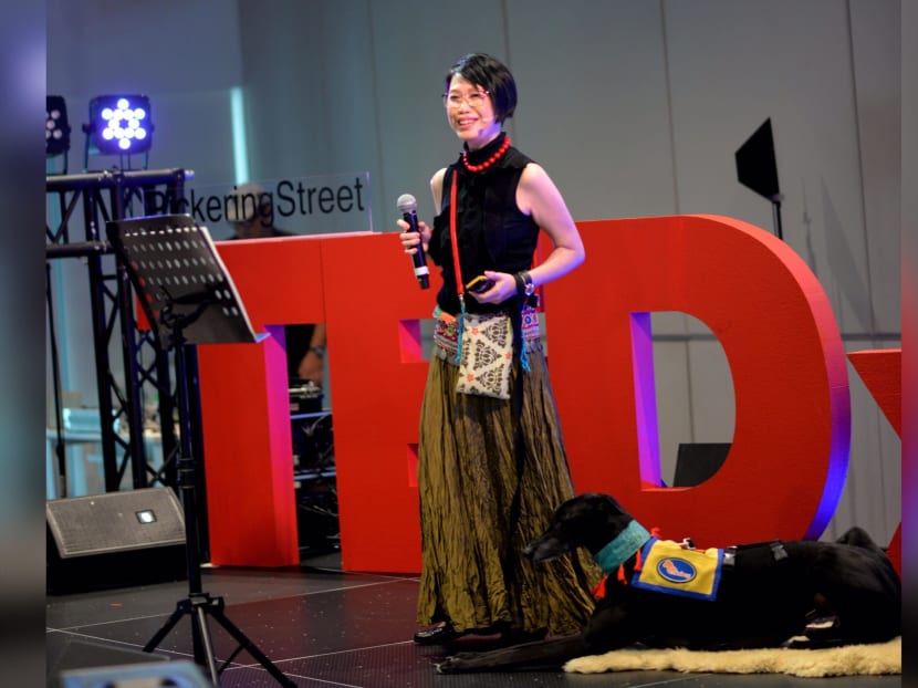The author, seen here with her sensory anxiety assistance dog, at a talk in 2018. The author, seen here with her sensory anxiety assistance dog, at a talk in 2018.