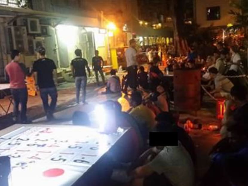 107 people were arrested in Geylang during a week-long operation for their suspected involvement in various offences such as vice, public gaming, drug offences, peddling of contraband cigarettes, immigration offences, and selling of illegal sexual enhancement products. Photo: Singapore Police Force